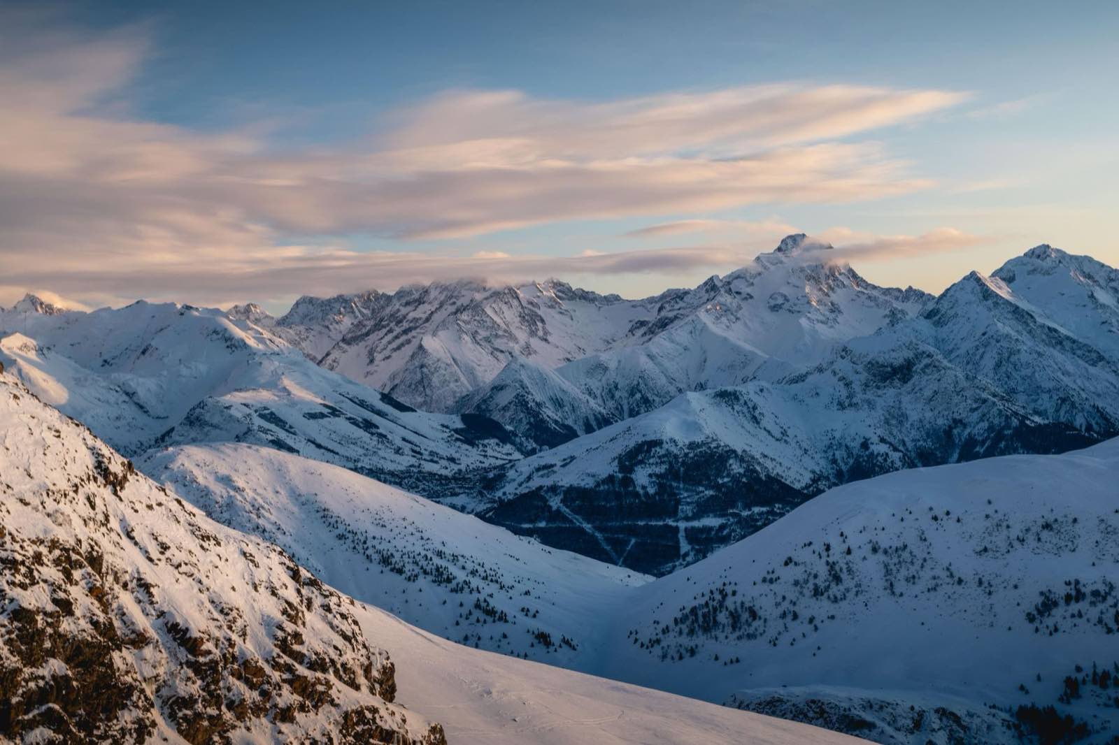 Evening light over a snow-covered mountain range