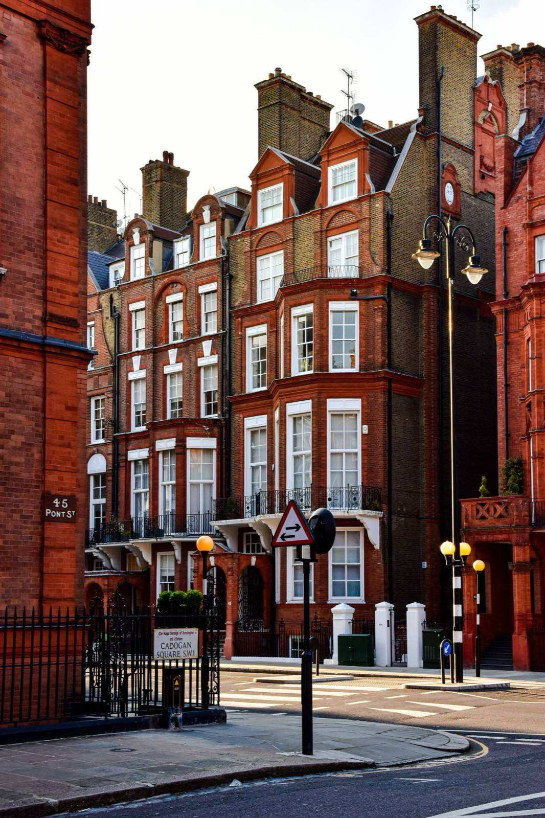 A row of brick townhouses in London